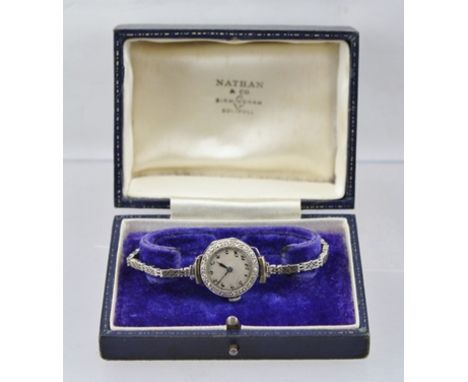 A LADY'S EVENING WATCH, 18ct white gold case with silvered dial, bearing Arabic numerals, the bezel set eighteen cut diamonds