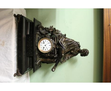 AN EDWARDIAN MANTEL CLOCK with substantial bronzed spelter mount of a voyager, possibly Christopher Columbus, circular white 