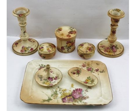 A ROYAL WORCESTER PORCELAIN DRESSING TABLE SET, comprising tray 26.5cm wide, a pair of candlesticks, three lidded pots, a rin