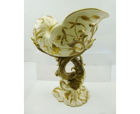 A "FISCHER OF BUDAPEST" ART POTTERY CENTRE PIECE, formed as a shell upon a stem of stylised fish and seaweed, on a scallop sh