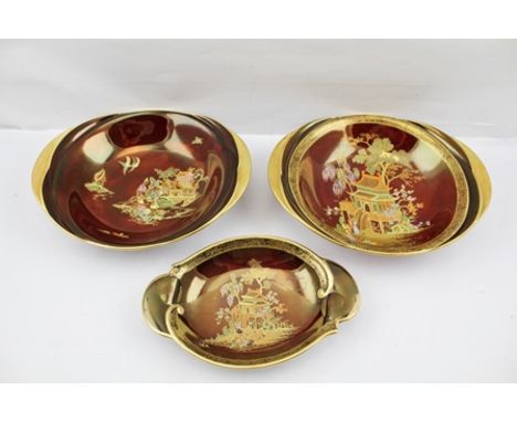 CARLTONWARE ROUGE ROYALE, three elliptical bowls, jewelled polychrome decoration with Oriental scenes on red ground, gilt edg