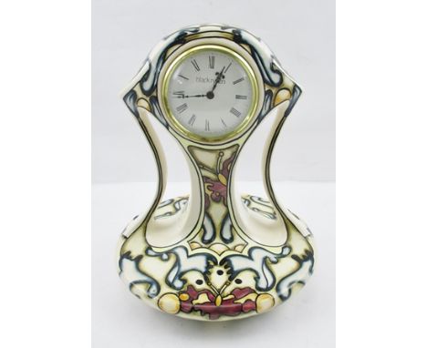 A "BLACK RYDEN" POTTERY CASED MANTEL CLOCK in hand painted "Timeflight" pattern, designed by Kerry Goodwin, impressed and pai