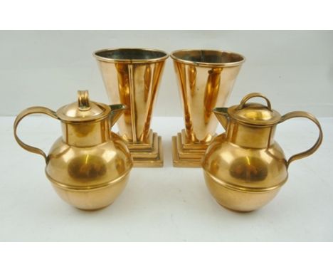 A PAIR OF GUERNSEY COPPER CREAM CANS and a pair of ART DECO COPPER VASES of tapering cone form, on square stepped bases, 13cm