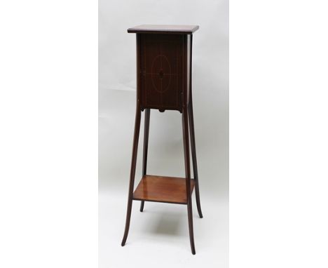 AN EDWARDIAN MAHOGANY JARDINIERE STAND of Art Nouveau design, the top fitted with a single cupboard door, with string inlay, 