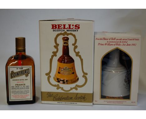 Cointreau Angers France, one bottle; and two Bell's commemorative Scotch Whisky decanters (3)