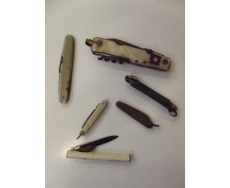 Six various penknifes to include an early Swiss Army penknife 