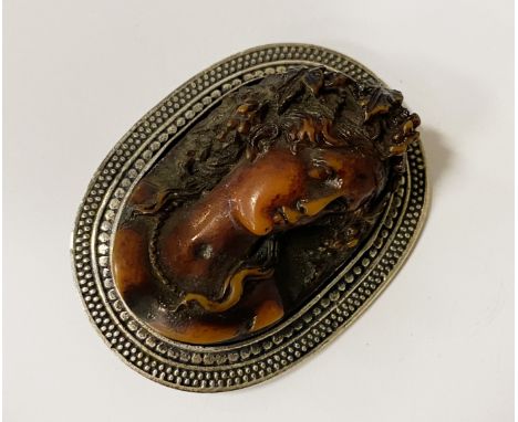 CARVED BUTTER SCOTCH AMBER AND SILVER CAMEO BROOCH