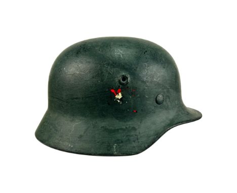 German M1940 helmet manufactured by F.W. Quist G.m.b.H., Esslingen. The shell is stamped Q68 with the number SC72C (?). It fe