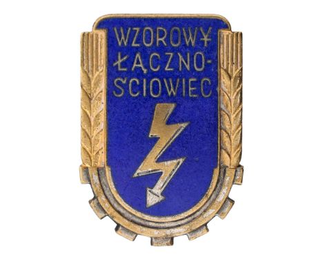 Badge of the Exemplary Signalman WZ.53The badge is a single-piece, enameled shield with a lightning bolt in the center, symbo