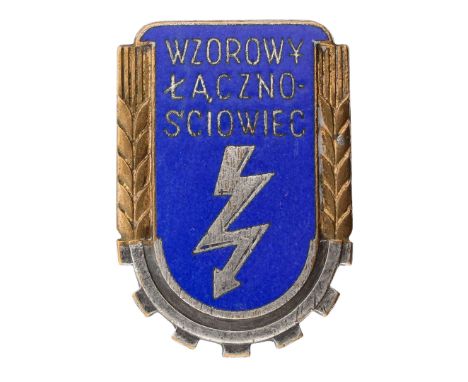 Badge of the Exemplary Signalman WZ.53The badge is a single-piece, enameled shield with a lightning bolt in the center, symbo