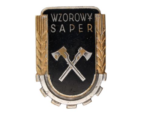 Badge of the Exemplary Sapper WZ.53The badge is a single-piece, enameled shield with two crossed sapper axes in the center. A