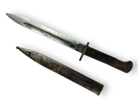 Bayonet with a single-edged blade, featuring a double-edged concave fuller. The bayonet's tang is single-sided. The handle ha