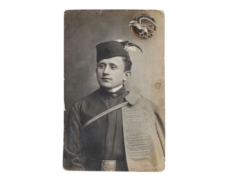 Photograph of a member of the Gymnastic Society "Sokół" with the original "Sokół" collar badge. The badge was made by the com