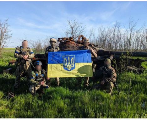 "Ukrainian flag signed by soldiers of the Armed Forces of Ukraine (ZSU) from the 47th Brigade, 238th Battalion, fighting in t