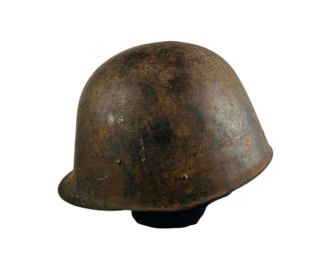 Single-piece helmet with a slight undercut and a small, yet noticeable, shaped brim. The edges of the helmet are trimmed and 