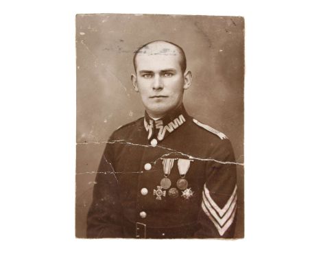 A photograph of Sergeant Zygmunt Riedel, born on December 23, 1899. His uniform displays the Commemorative Medal for the 1918