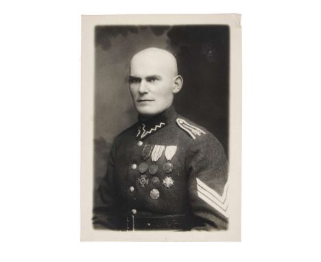 A portrait photograph of Sergeant Zygmunt Riedel, born on December 23, 1899. His uniform displays the Independence Medal, the