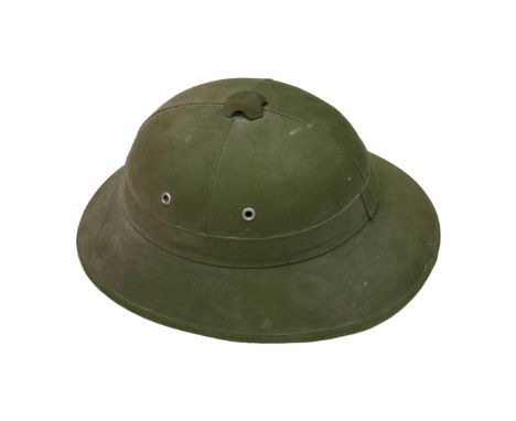 Cork helmet of the Vietnam Army. Overall condition as shown in the pictures.