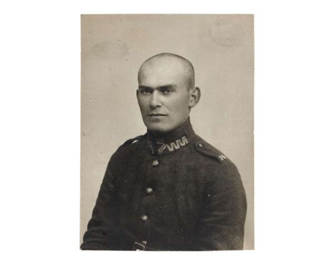 A portrait photograph of Zygmunt Riedel, a soldier of the 10th Infantry Regiment. He is dressed in a wz.19 jacket, with the r