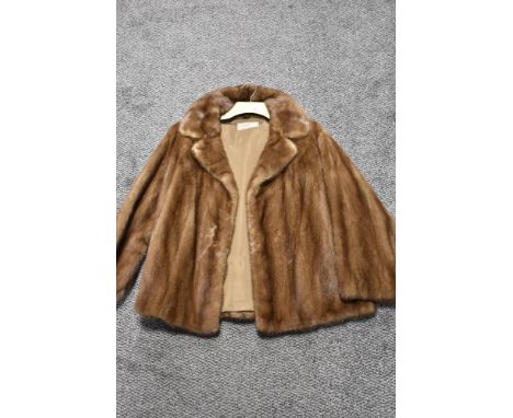 A vintage caramel mink jacket having 'M J L' monogrammed to lining.