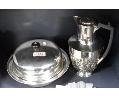 A silver plated coffee pot and a serving dish.