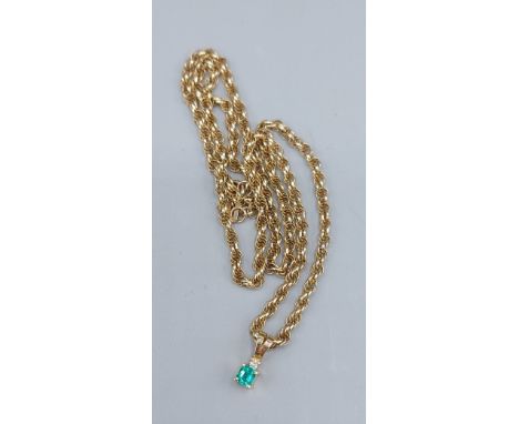 An 18ct gold Emerald and Diamond set pendant 0.7gms together with a 9ct gold woven chain, 6gms