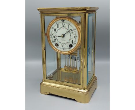 A brass Library clock, the enamel dial inscribed Seth Thomas with Arabic numerals and two train movement striking on a gong, 