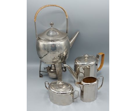 A WMF silver plated spirit kettle of beaten form with cane handle together with a similar WMF silver plated three piece tea s