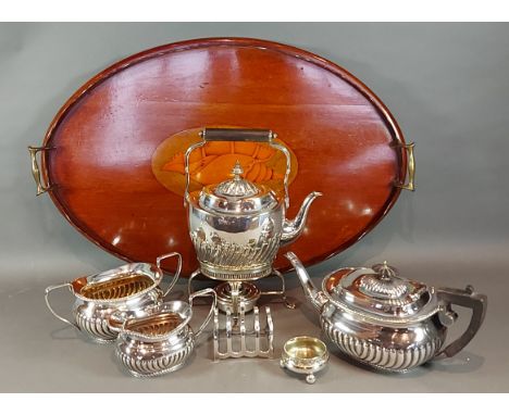 A mahogany shell inlaid oval tray with end handles together with a silver plated sprit kettle, a silver plated three piece te