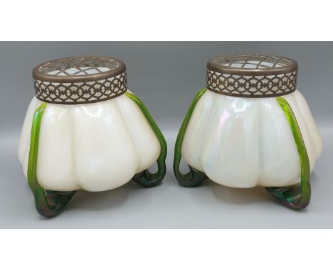 A pair of Loetz iridescent glass vases of melon form, 15cms tall