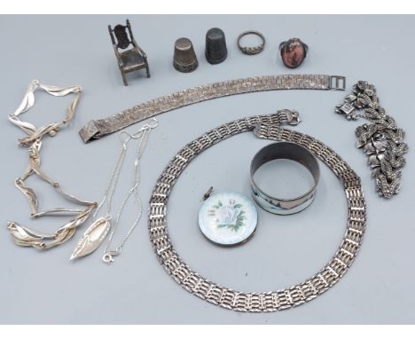 An enamel decorated pendant locket together with a collection of silver jewellery 