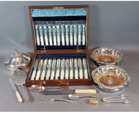 A pair of silver plated bottle coasters together with a silver plated entree cover and a small collection of flatware and a c