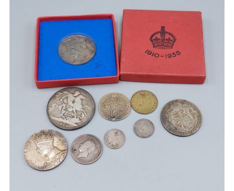 A George II silver Shilling dated 1758, (drilled) together with other British silver coinage