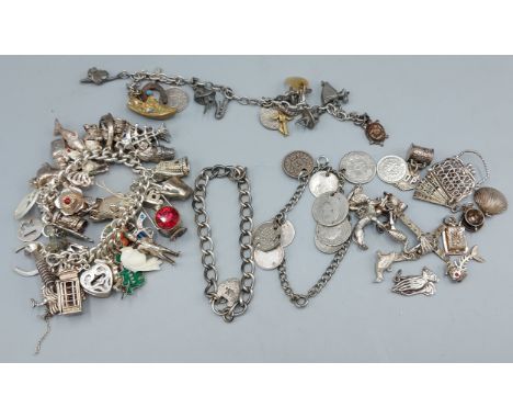 Two silver Charm bracelets together with various loose charms and a coin set bracelet 