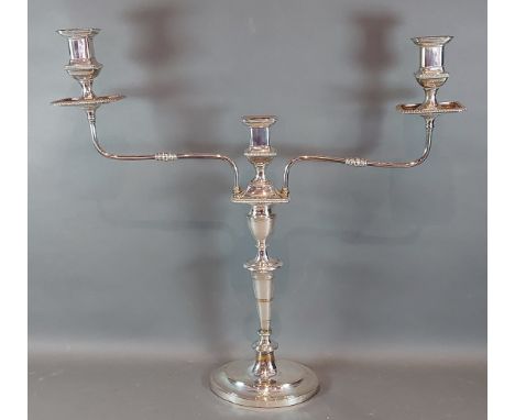 A silver plated three branch candelabra, 50cms tall