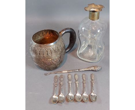 A white metal mug together with a silver mounted decanter, a set of six 800 mark spoons and a silver handled button hook