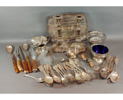 A pair of silver plated candlesticks together with a small collection of plated items to include flatware 