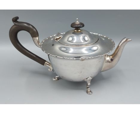A Birmingham silver teapot with ebonised handle, 11ozs
