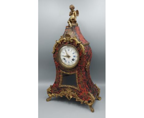 A French Boulle and gilt metal mounted mantle clock with figural cresting, the enamel dial inscribed Valery A Paris, 41cms ta