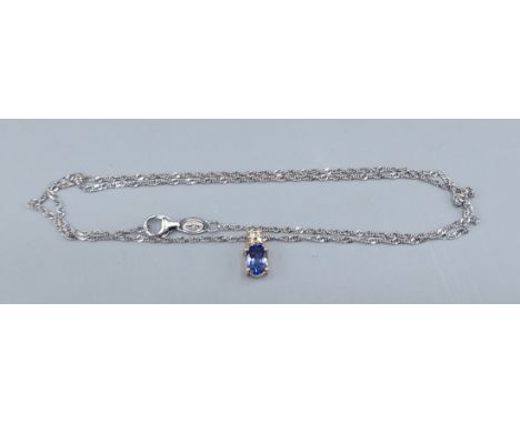 A 14ct gold Topaz and Diamond pendant with 14ct gold chain, 2.9gms, 45cms long