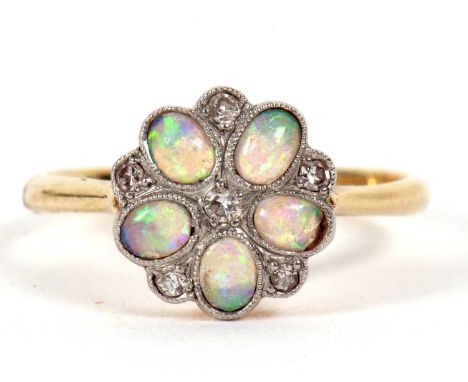 An 18ct and platinum opal and diamond ring, the flowerhead cluster with oval opal cabochon petals interspaced with small roun