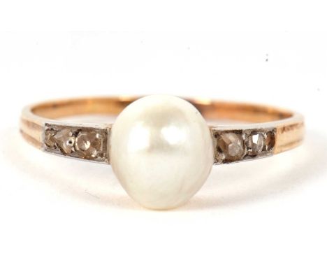 A 'pearl' and diamond ring, the central 'pearl', approx. 8.5mm diameter, set to either side with small old mine and rose cut 