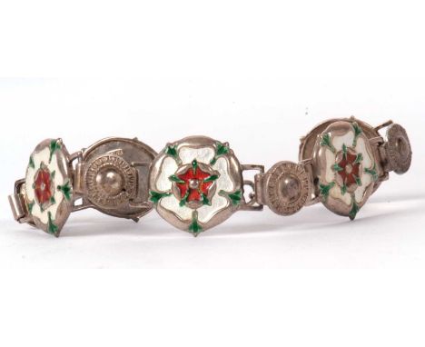 A silver and enamel bracelet, the five Tudor rose style enamelled links, each stamped 'silver' to reverse, interspaced with s