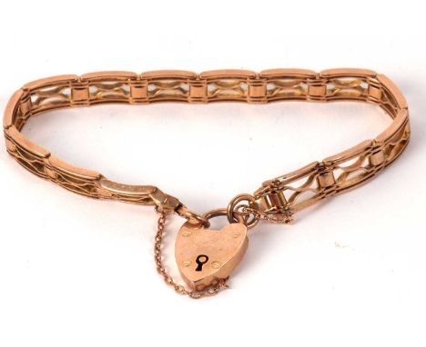 A fancy link gate style bracelet, indistinctly stamped 9ct to one end and worn mark to other end (tests as approx. 9ct gold),