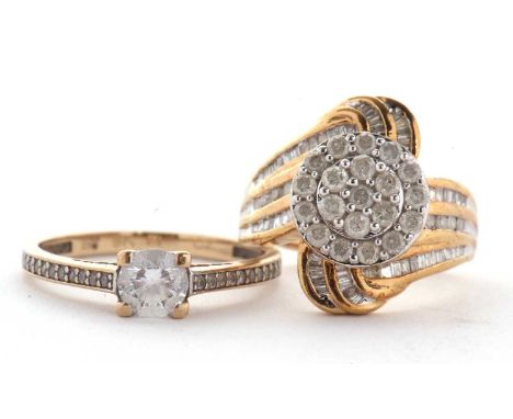 Two 9ct rings: the first set with a cluster or round brilliant cut diamonds with a curved flourish tapering down the shoulder