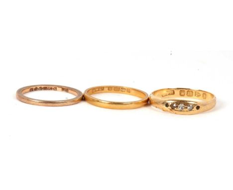 Three gold rings: an 18ct diamond ring, Chester 1896, size O, 3.0g, (a/f); a 22ct wedding band, Birmingham 1922, size O, 2.1g