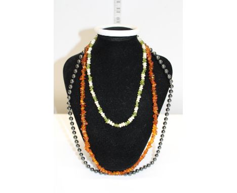Amber Necklace, Peridot and Pearl necklace and a Haematite necklace and semi precious stone bangle 