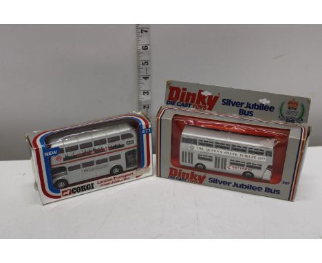 A dinky and Corgi boxed die-cast bus models 