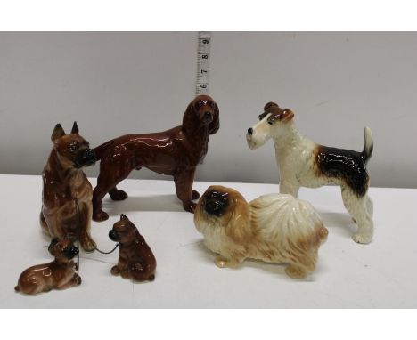 A selection of ceramic dog figures 