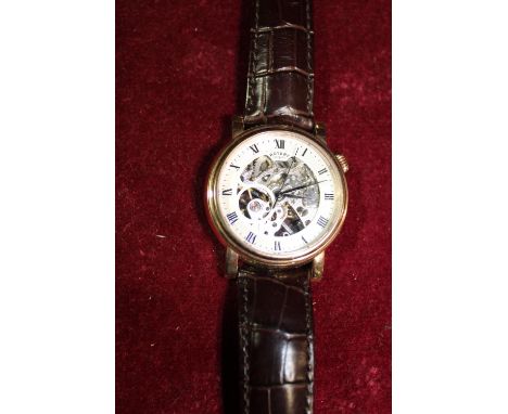 A gold tone case rotary watch in GWO 